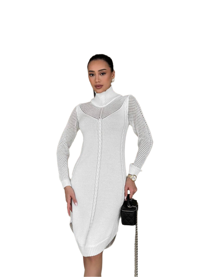 Woman wearing a white knit dress with a black handbag on a white background