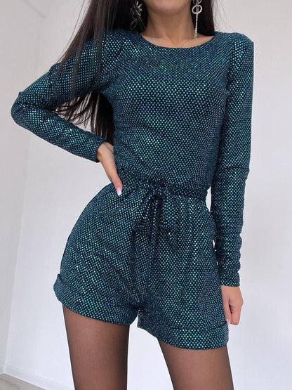 Teal patterned long-sleeve top and shorts set on a white background