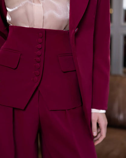 Close-up of a burgundy suit with a blurred background
