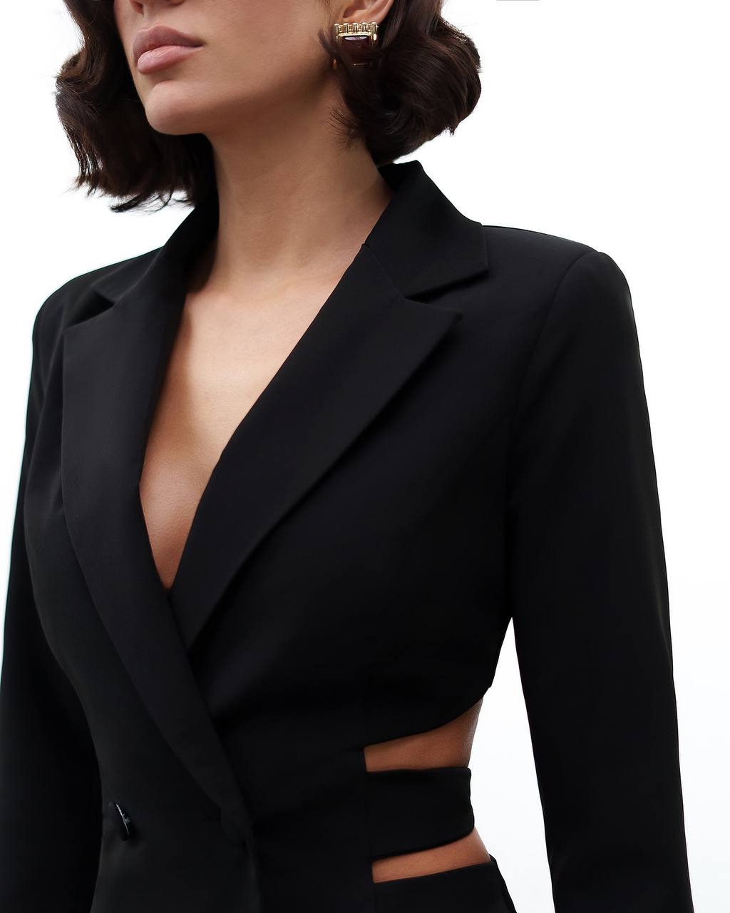 Black blazer with cut-out design on a white background