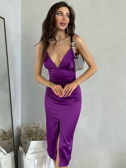 Woman wearing a purple dress with a white background
