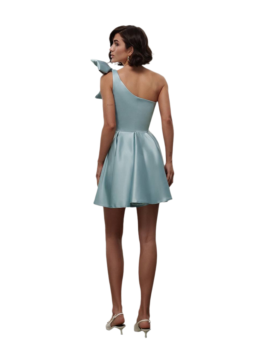 Woman wearing a light blue one-shoulder dress on a white background