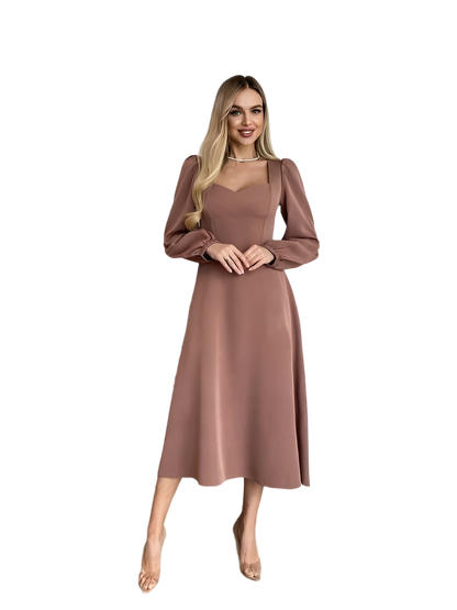 Woman wearing a brown dress on a white background