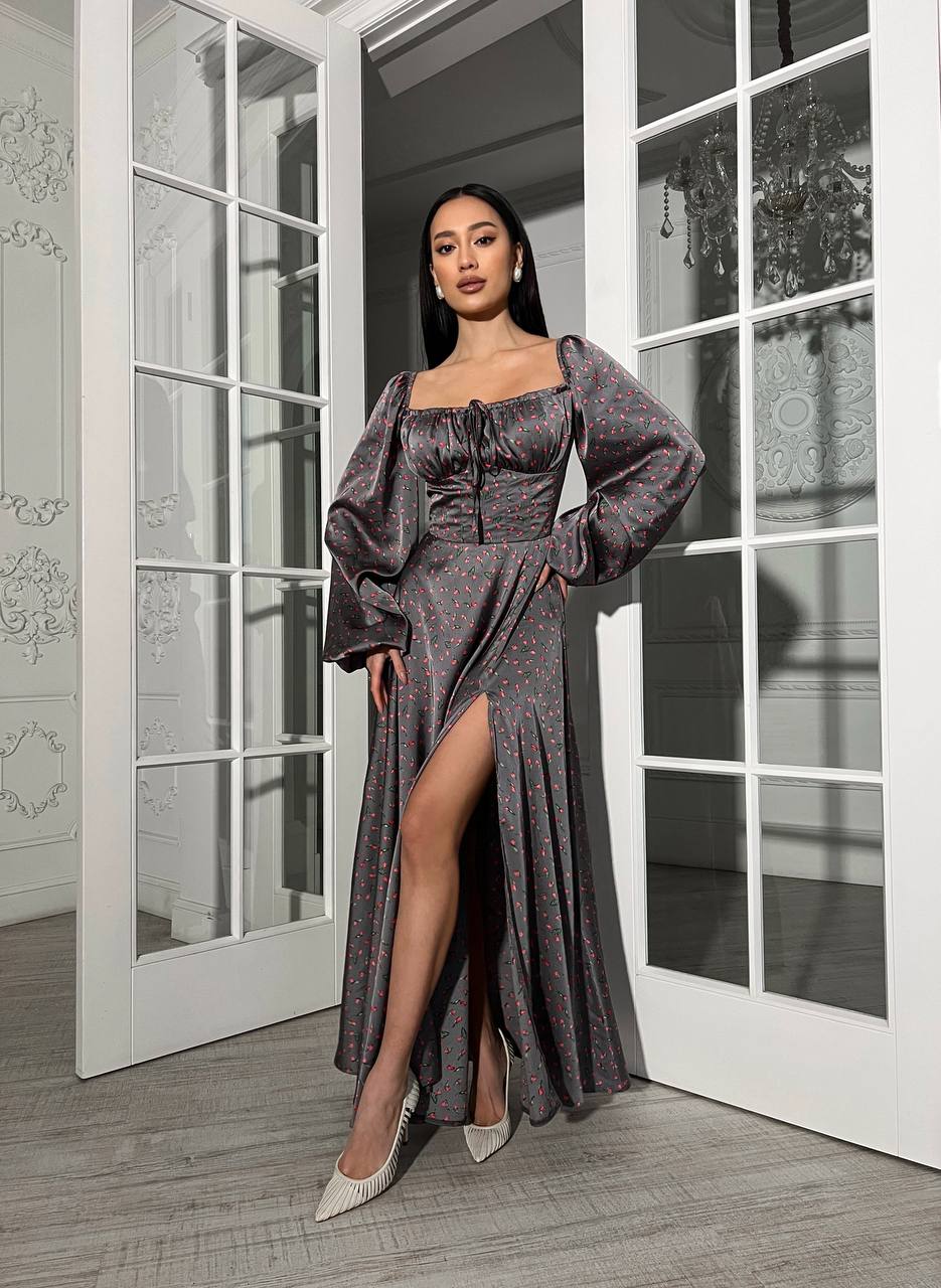 Woman in a glamorous dress standing in a stylish interior setting