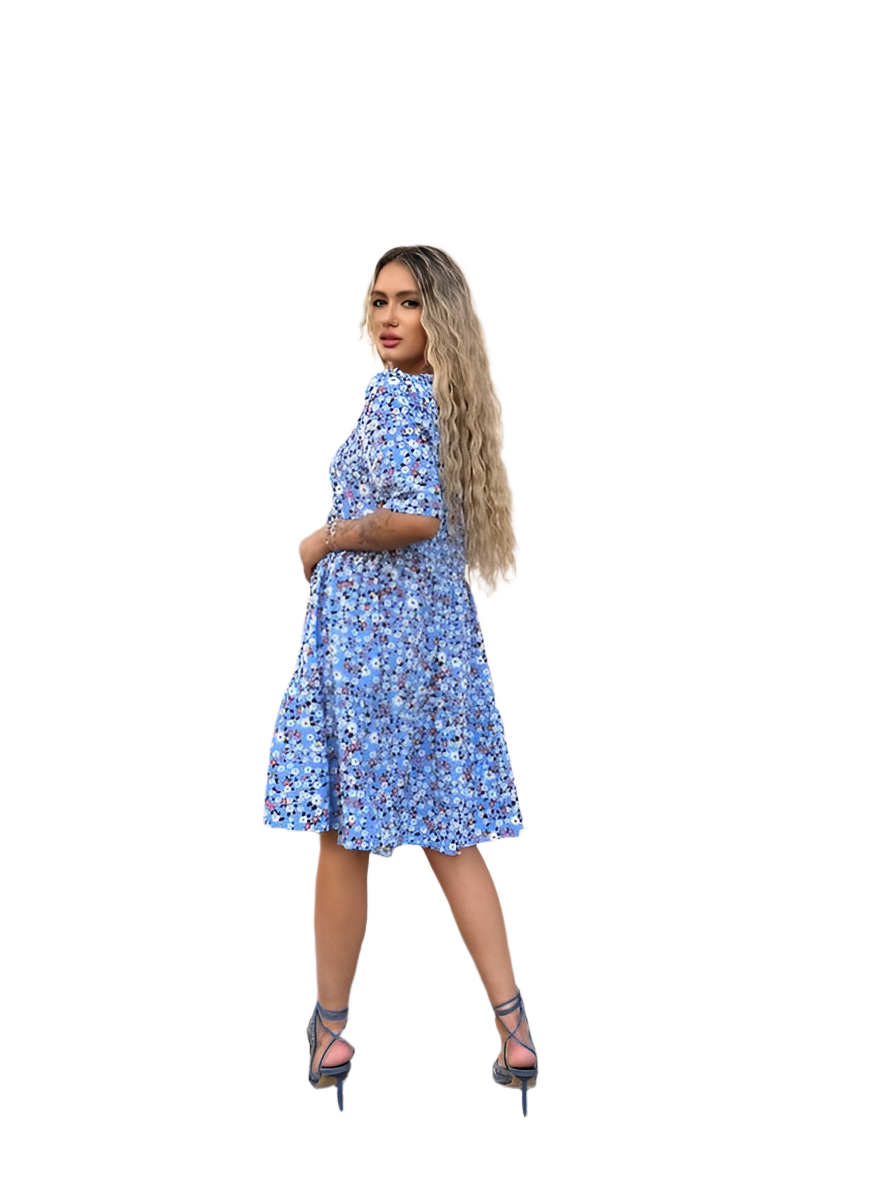 Woman wearing a blue floral dress on a white background