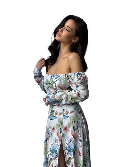 Woman wearing a floral off-shoulder dress on a white background