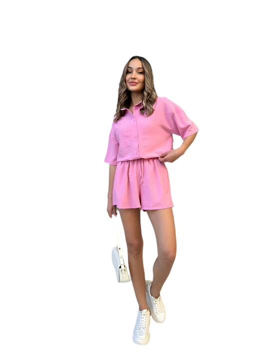 Woman wearing a pink outfit on a white background