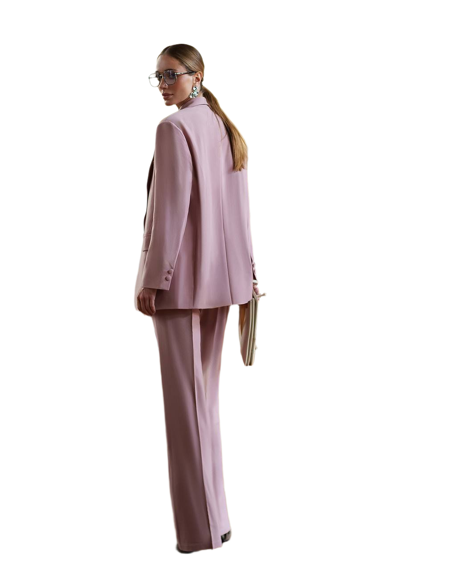 Woman wearing a pink suit on a white background