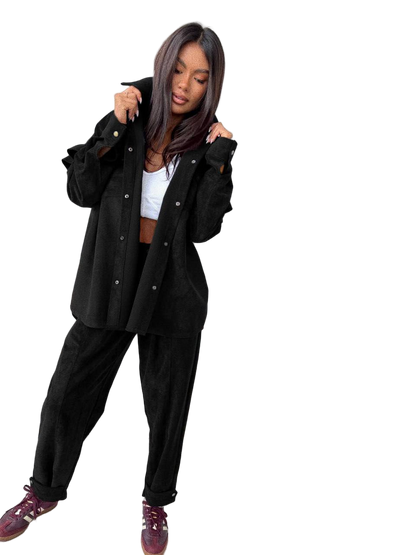Stylish Black Velvet Two-Piece Suit with Ruffle Shirt and Snap-Fastened Pants