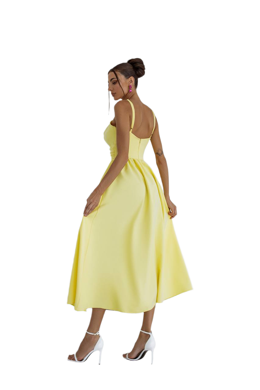Woman wearing a yellow dress on a white background