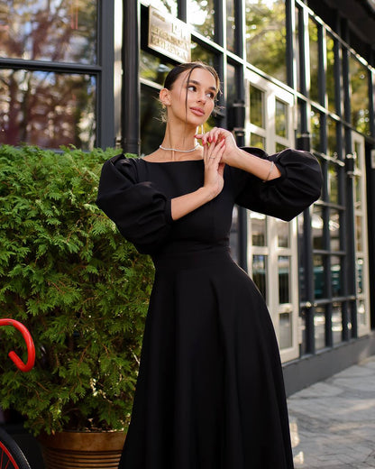 Elegant Midi Dress with Puff Sleeves and Cutout Back in Black