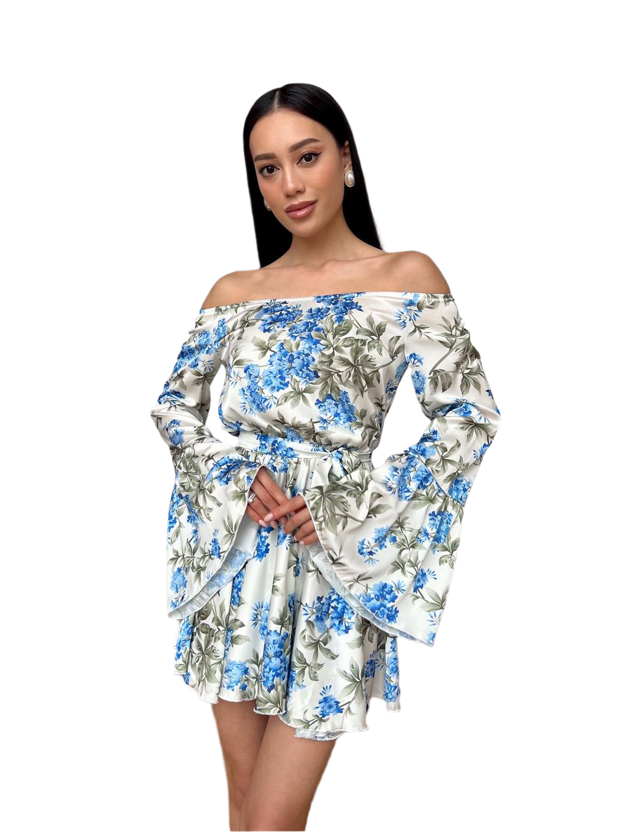 Woman wearing a floral off-shoulder dress on a white background