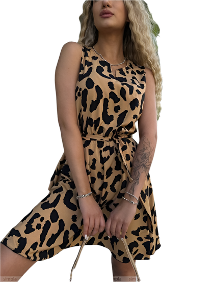 Woman wearing a leopard print dress on a white background