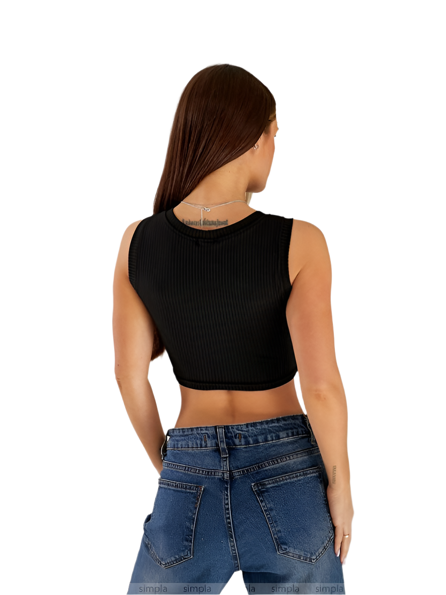 Person wearing a black sleeveless top and blue jeans on a white background