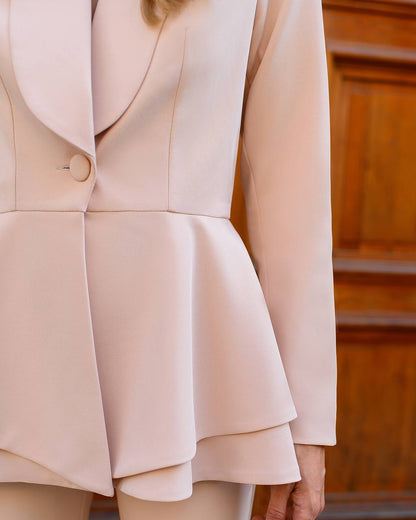 Close-up of a beige suit with a wooden background