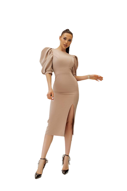 Woman wearing a beige dress with puffed sleeves on a white background