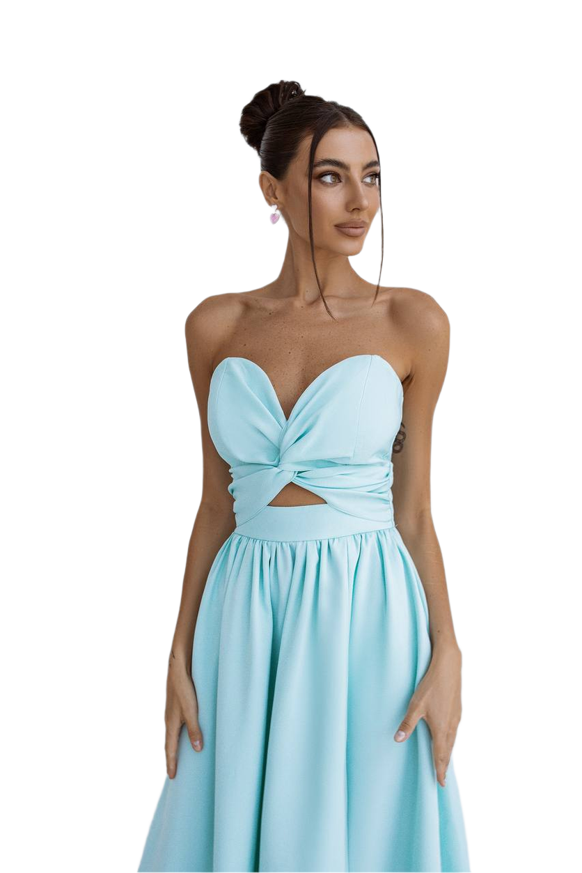 Woman wearing a light blue strapless dress with a cutout design on a white background