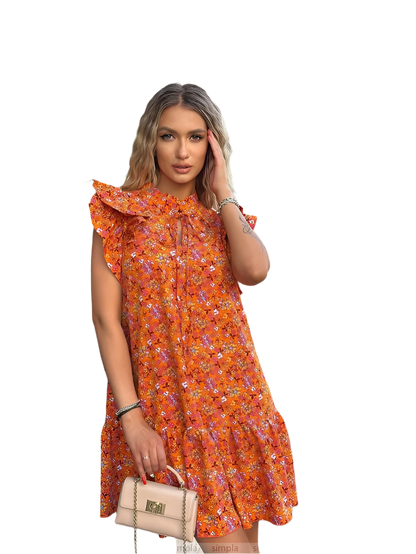 Woman wearing an orange floral dress on a white background