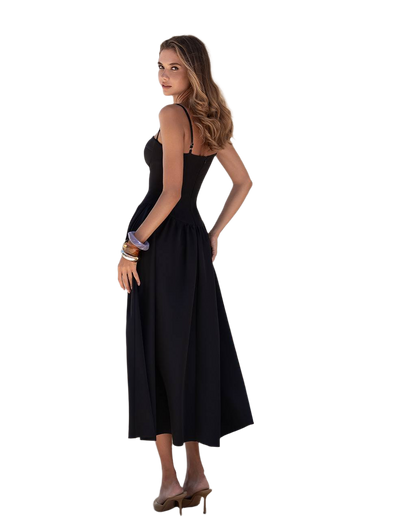 Woman wearing a black dress on a white background