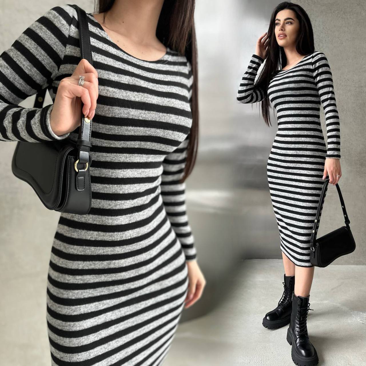 Woman wearing a black and white striped dress holding a black handbag.