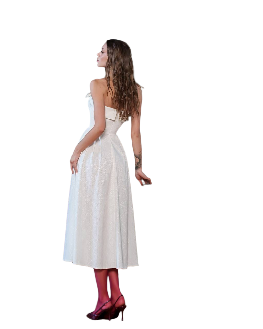 Woman wearing a white dress with red shoes on a white background