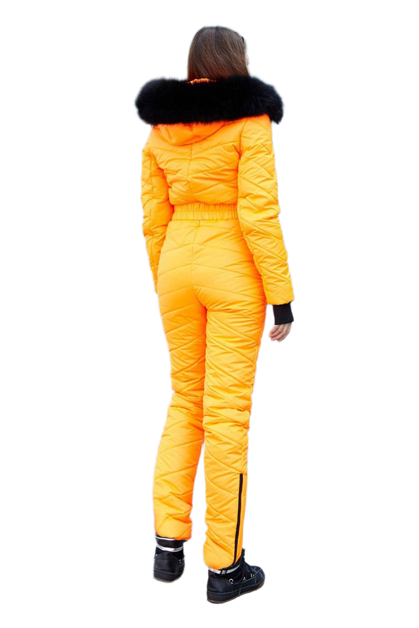 Person wearing a bright yellow snowsuit with black fur trim on a white background