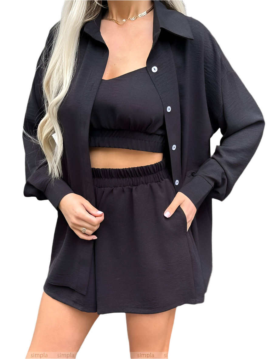 Person wearing a black outfit with a cardigan on a white background