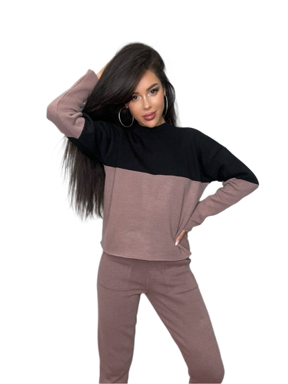 Woman wearing a two-tone outfit with a black and brown color scheme on a white background