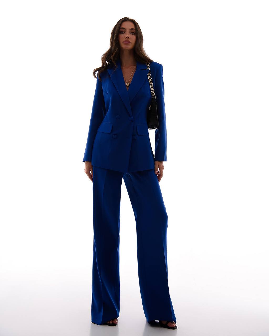 Woman wearing a blue suit on a white background