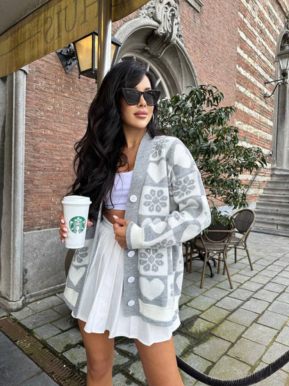 Woman holding a Starbucks cup in an urban setting
