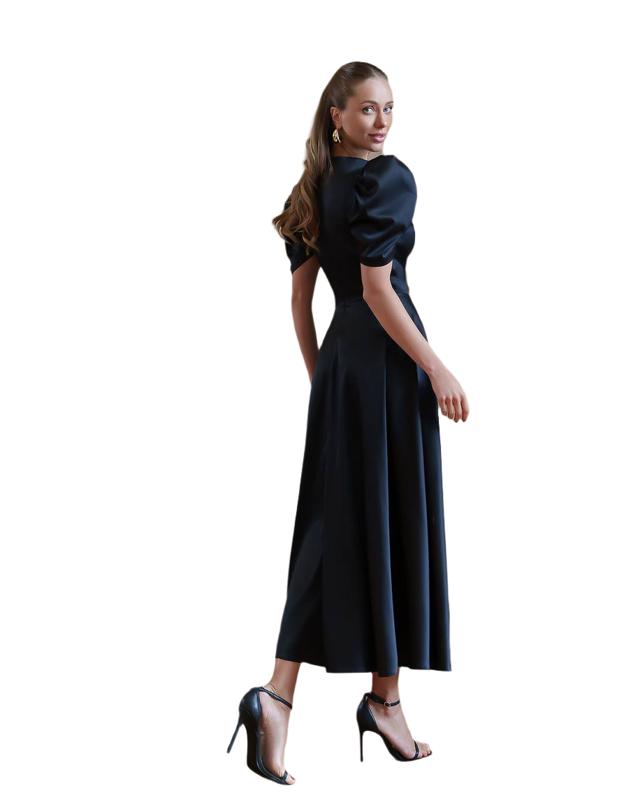 Woman wearing a black dress with puffed sleeves on a white background