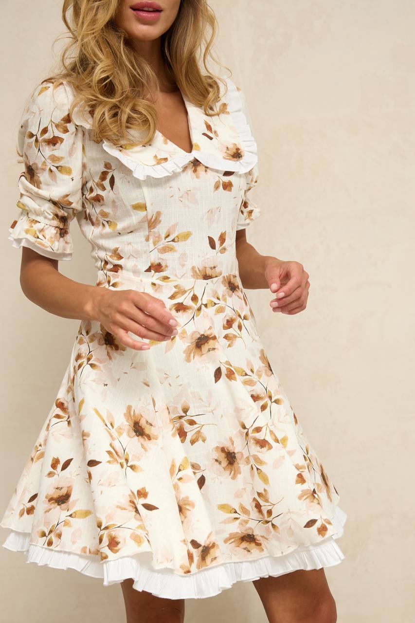 Woman wearing a floral dress with a plain background