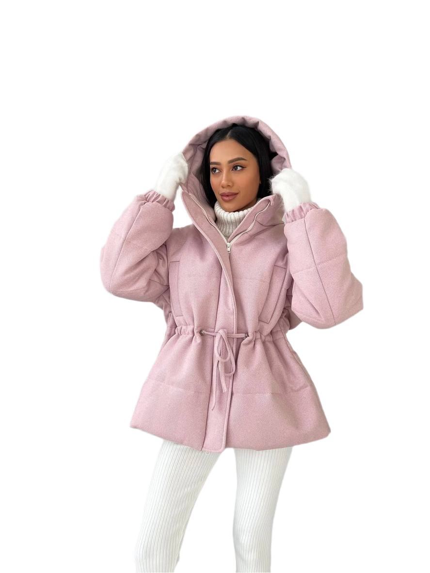 Woman wearing a pink hooded coat on a white background