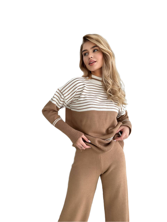Woman wearing a brown and white striped sweater with matching pants on a white background