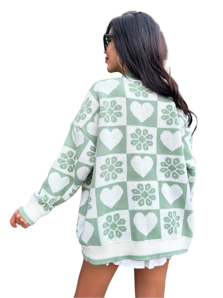 Woman wearing a green and white patterned cardigan on a white background