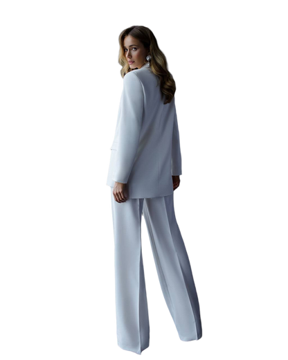 Woman wearing a light blue suit on a white background
