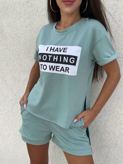 Person wearing a light green t-shirt with a humorous text design against a neutral background