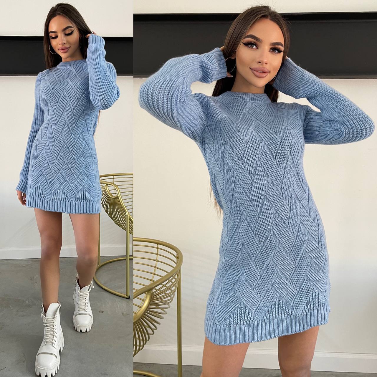 Woman wearing a blue knitted dress with a white background