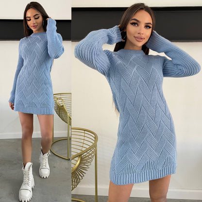 Woman wearing a blue knitted dress with a white background