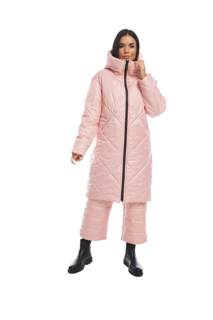 Person wearing a pink puffer coat and pants on a white background