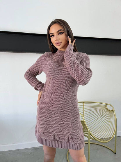 Woman wearing a pink knitted dress in a minimal indoor setting