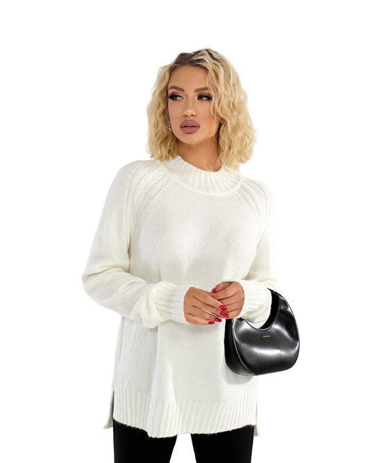 Woman wearing a white sweater holding a black handbag on a white background
