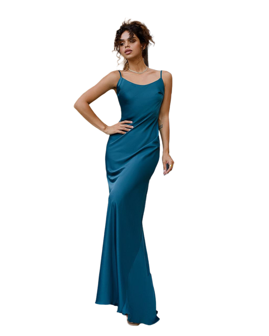 Woman wearing a teal evening gown on a white background