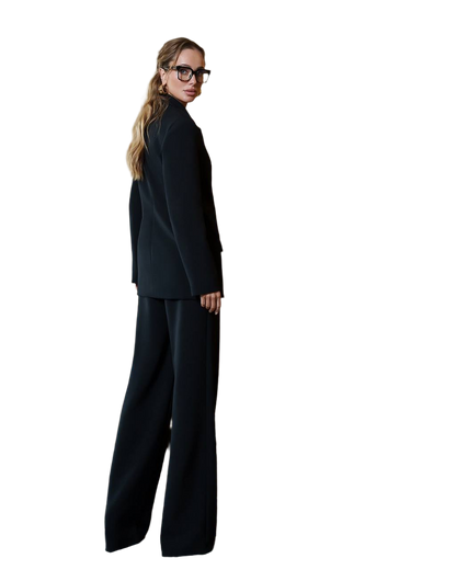 Person wearing a black suit on a white background