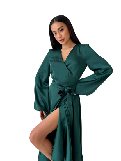 Woman wearing a green satin robe on a white background