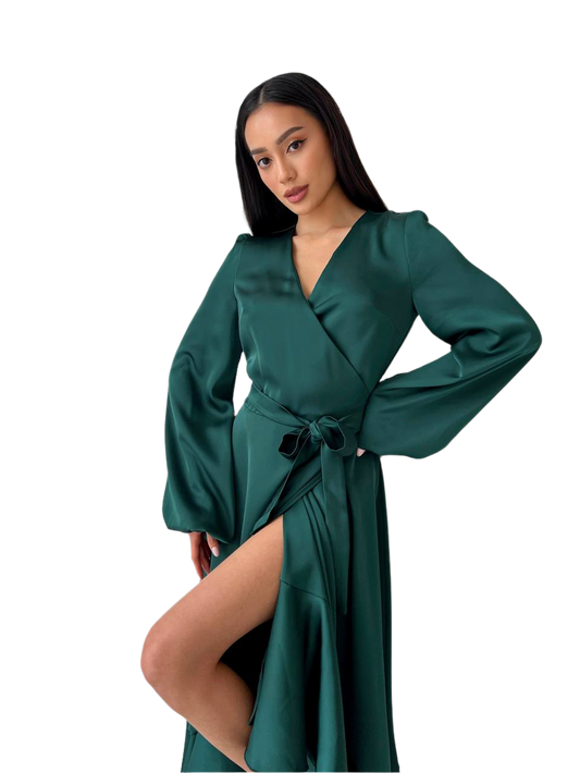 Woman wearing a green satin robe on a white background