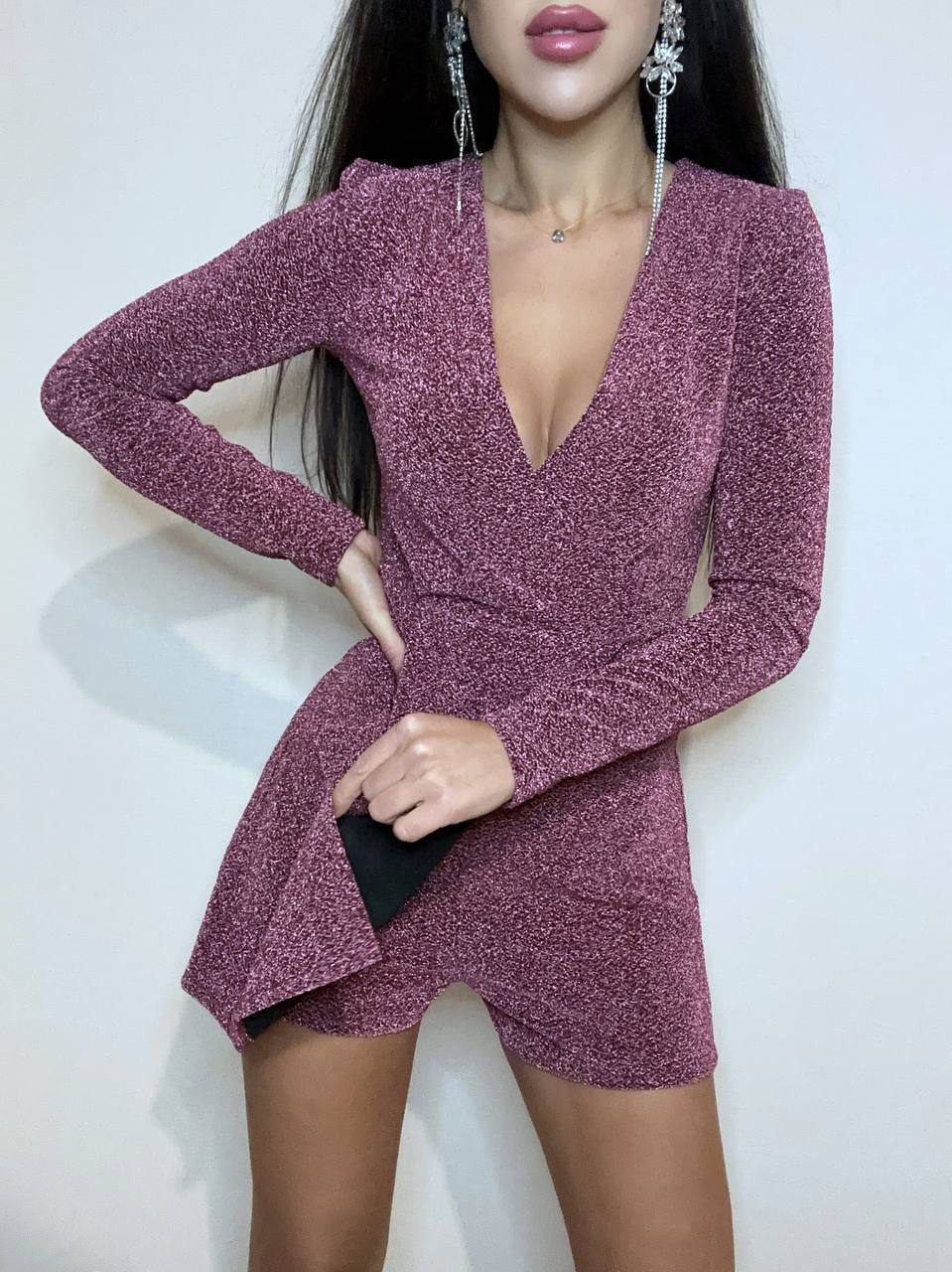 Mauve glittery dress worn by a model on a white background