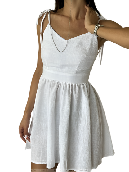 White dress with thin straps on a white background