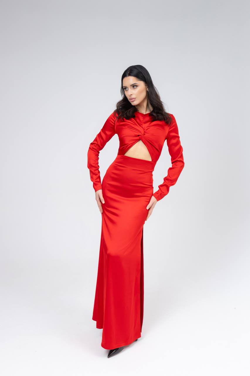 Woman wearing a red dress with cut-out design on a white background