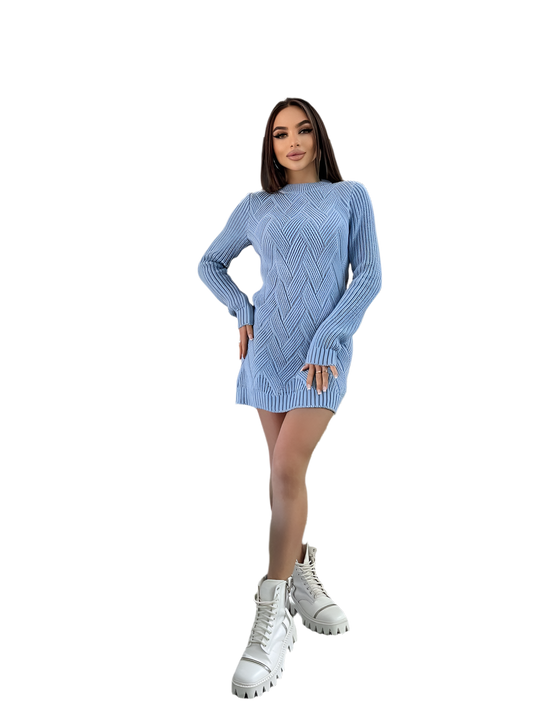 Woman wearing a blue knitted dress with white boots on a white background
